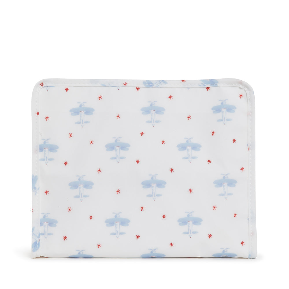 White pouch with blue airplane pattern on a white background